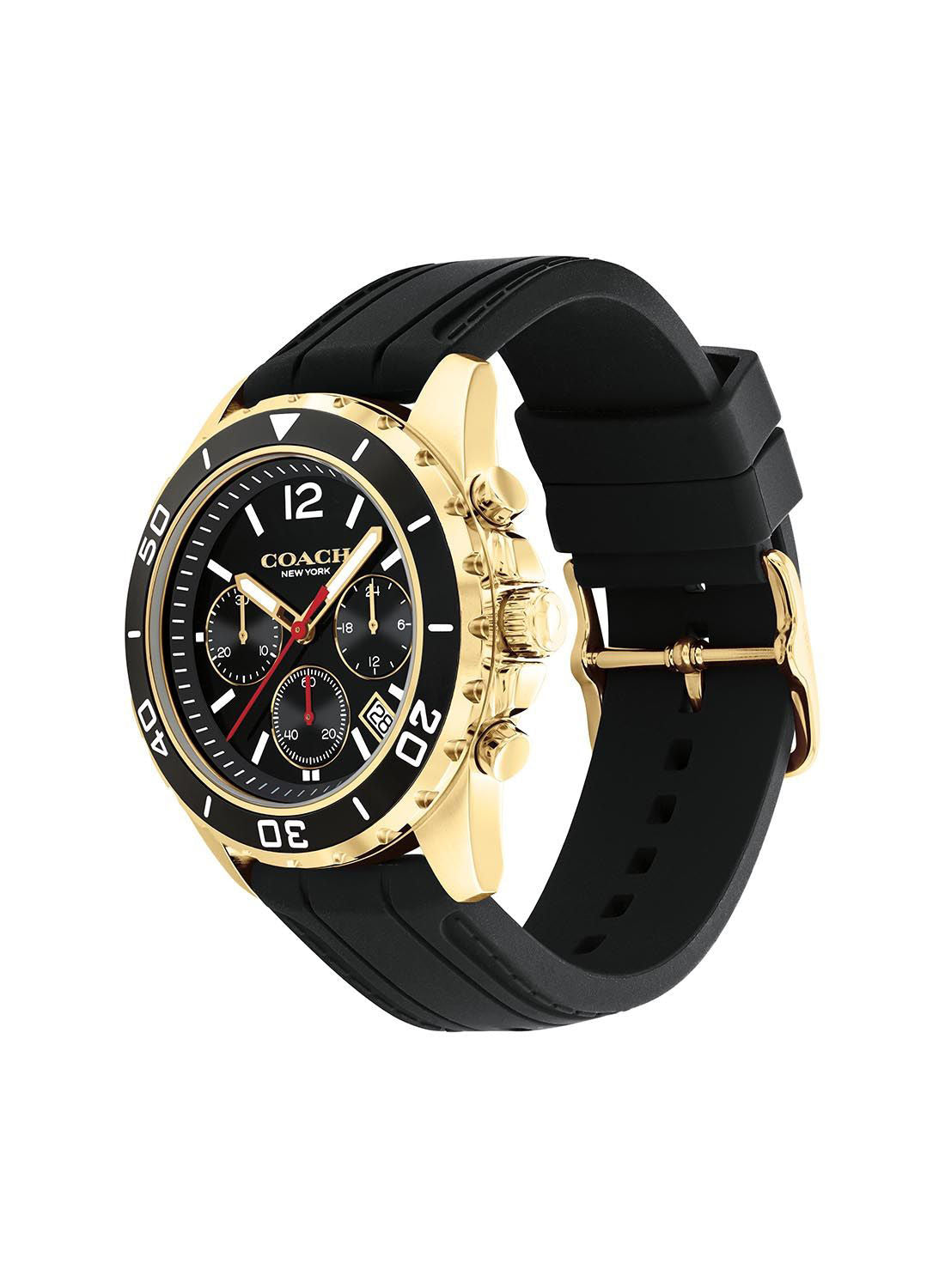 Coach Kent gold chronograph watch on wrist with black silicon strap
