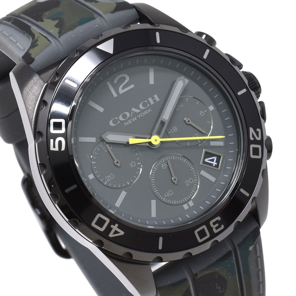 Close-up of Coach Kent watch dial showing chronograph subdials, hour markers, and yellow hands