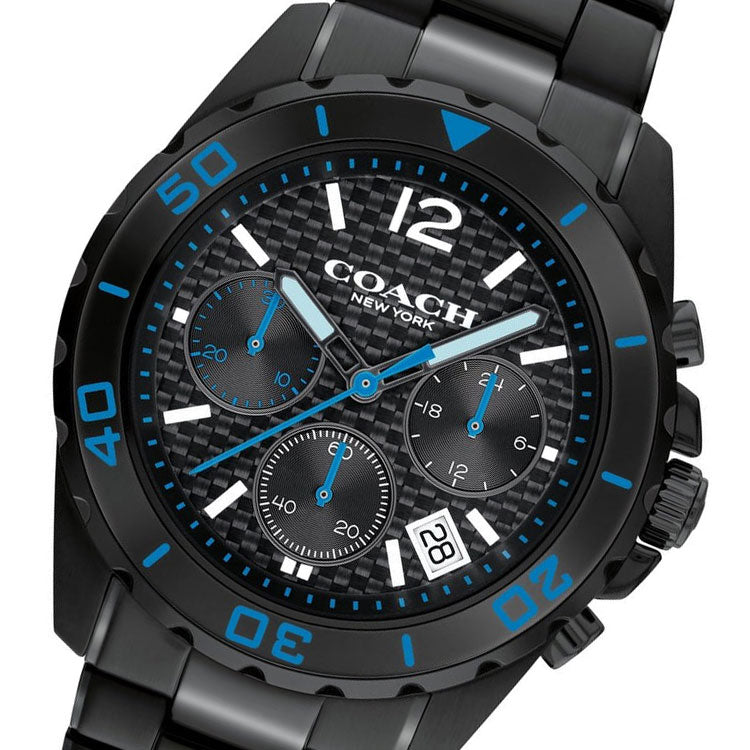 Close-up of Coach Kent chronograph dial with black face, blue hour markers, white hands, and subdials