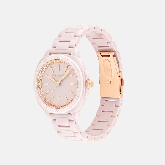Coach Kitt blush ceramic watch shown at angle with rose gold clasp detail