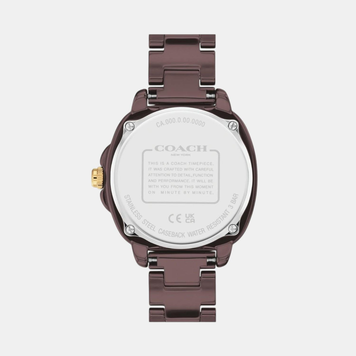 Coach Kitt watch caseback showing silver disc with Coach branding and specifications