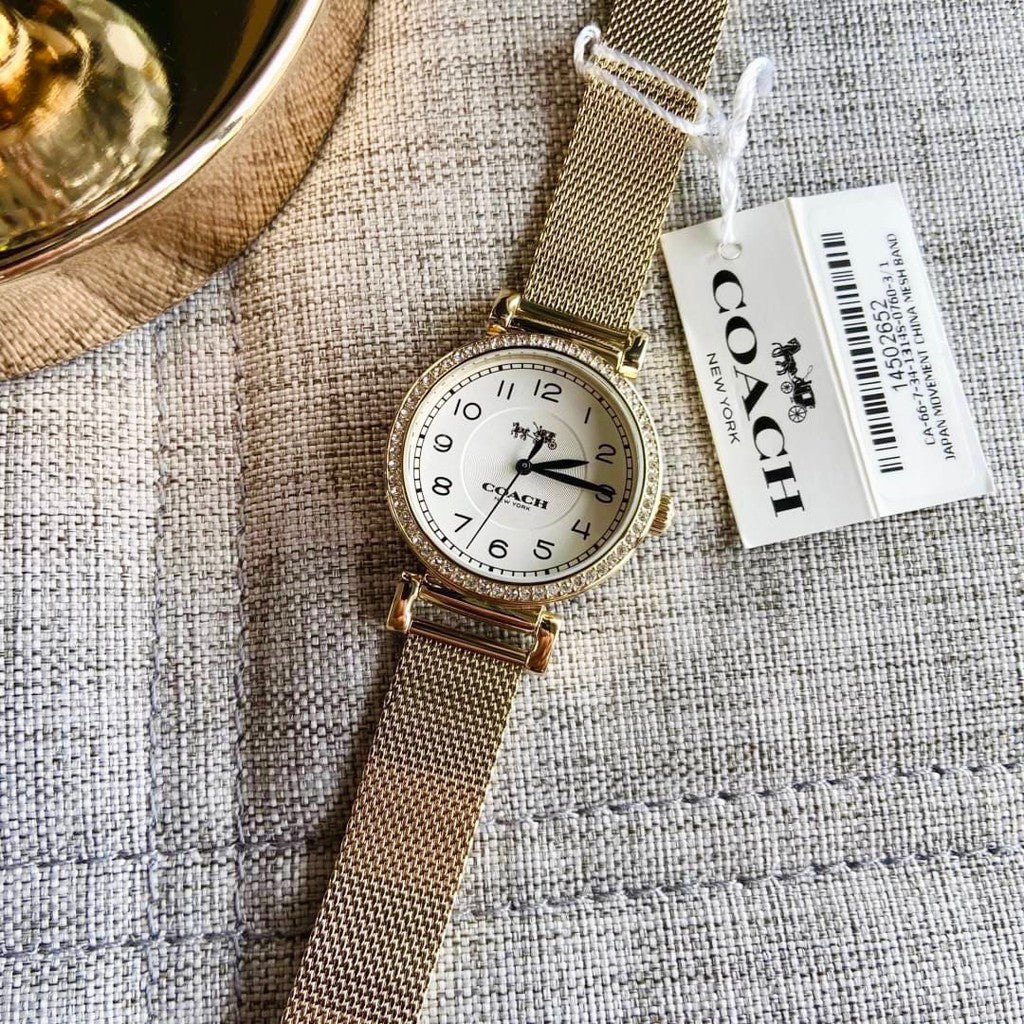 Coach Madison watch with care tag displayed on fabric surface
