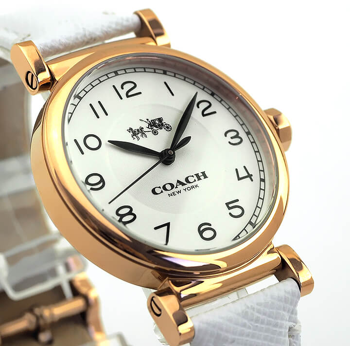 Close-up of Coach Madison watch dial with Arabic numerals and rose gold case