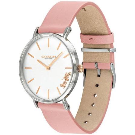 Coach Perry watch on wrist showing silver case, white dial, pink leather strap, and rose gold details