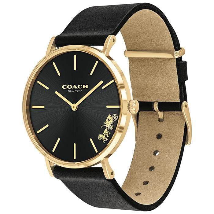 Coach Perry watch on wrist showing black leather strap and gold-tone case with black dial