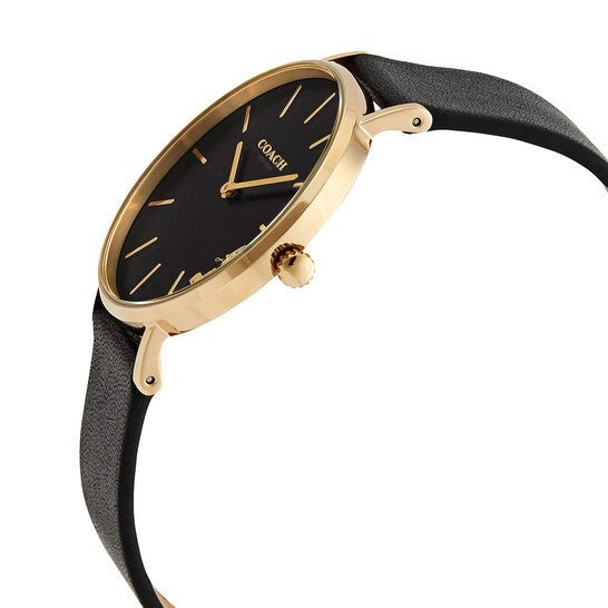 Side angle view of Coach Perry watch with gold-tone case, black dial, and black leather strap