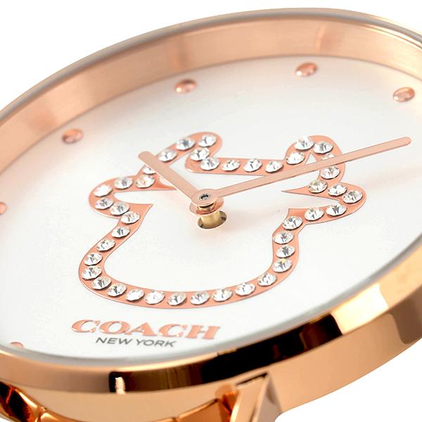 Close-up of Coach Perry dial featuring crystal-set horse logo and rose gold hands
