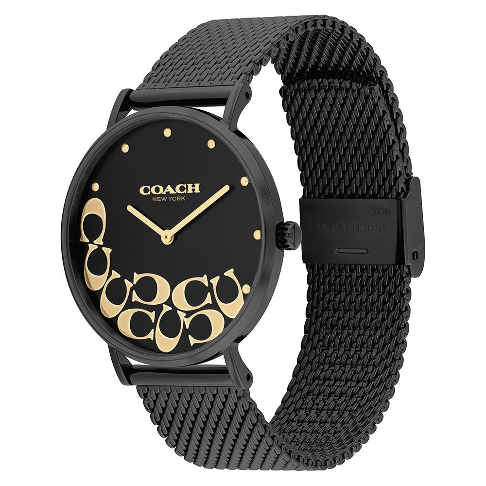 Coach Perry watch worn on wrist, showing black dial with gold signature pattern and mesh band