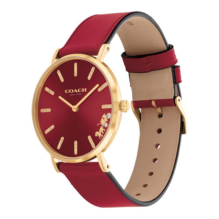 Coach Perry watch shown at angle with red leather strap and tan leather backing