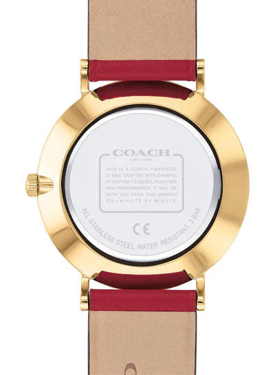 Coach Perry watch caseback showing white dial, gold-tone case, and engraved Coach text