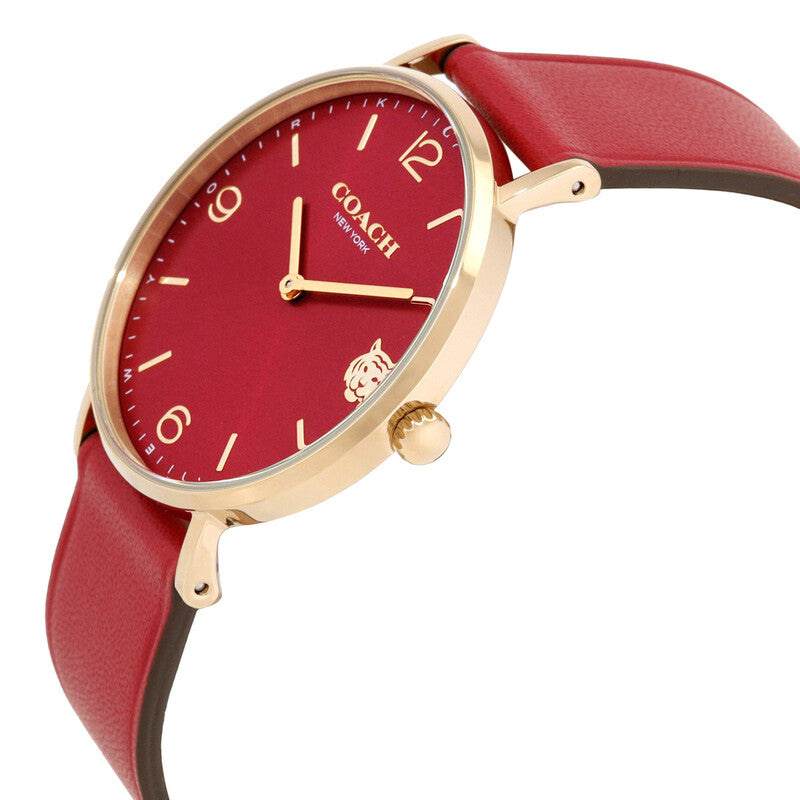 Side angle view of Coach Perry watch showing red leather strap and gold-tone lugs