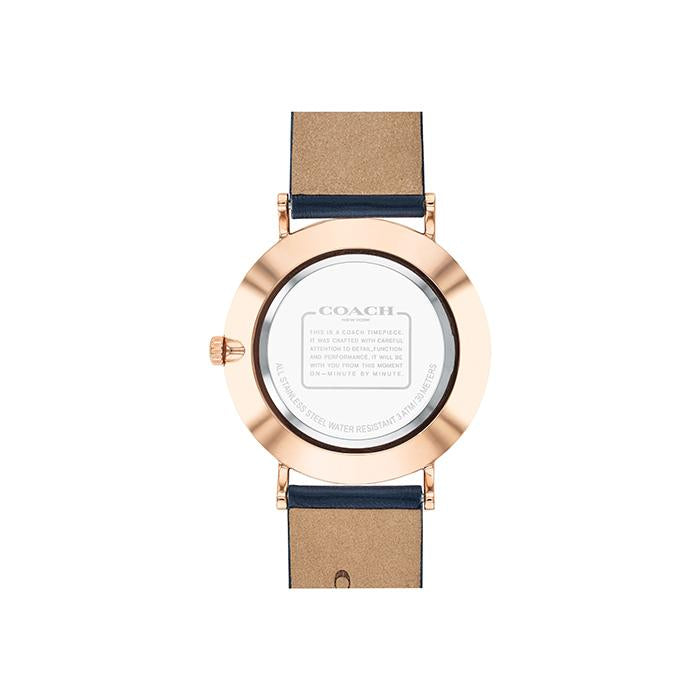 Coach Perry navy women's watch caseback with engraved Coach branding and warranty text, rose gold case