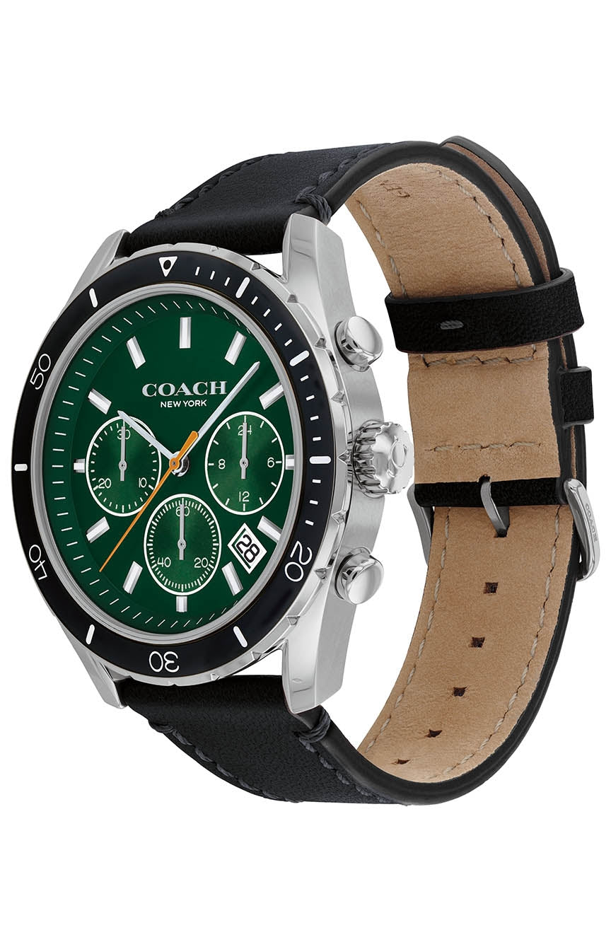 Coach Preston watch angled view showing green dial, black outer bezel, and black and tan leather strap