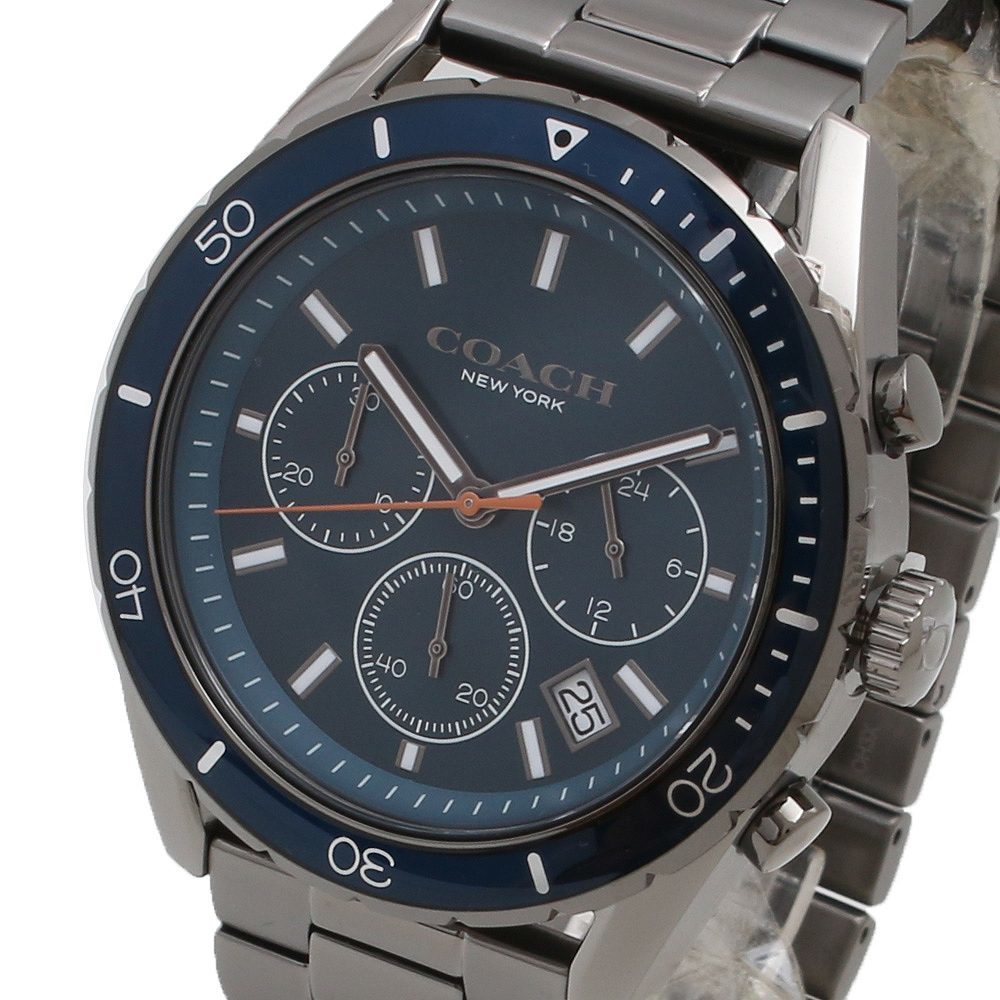 Close-up of Coach Preston dial showing blue face, three chronograph subdials, and rose gold hands
