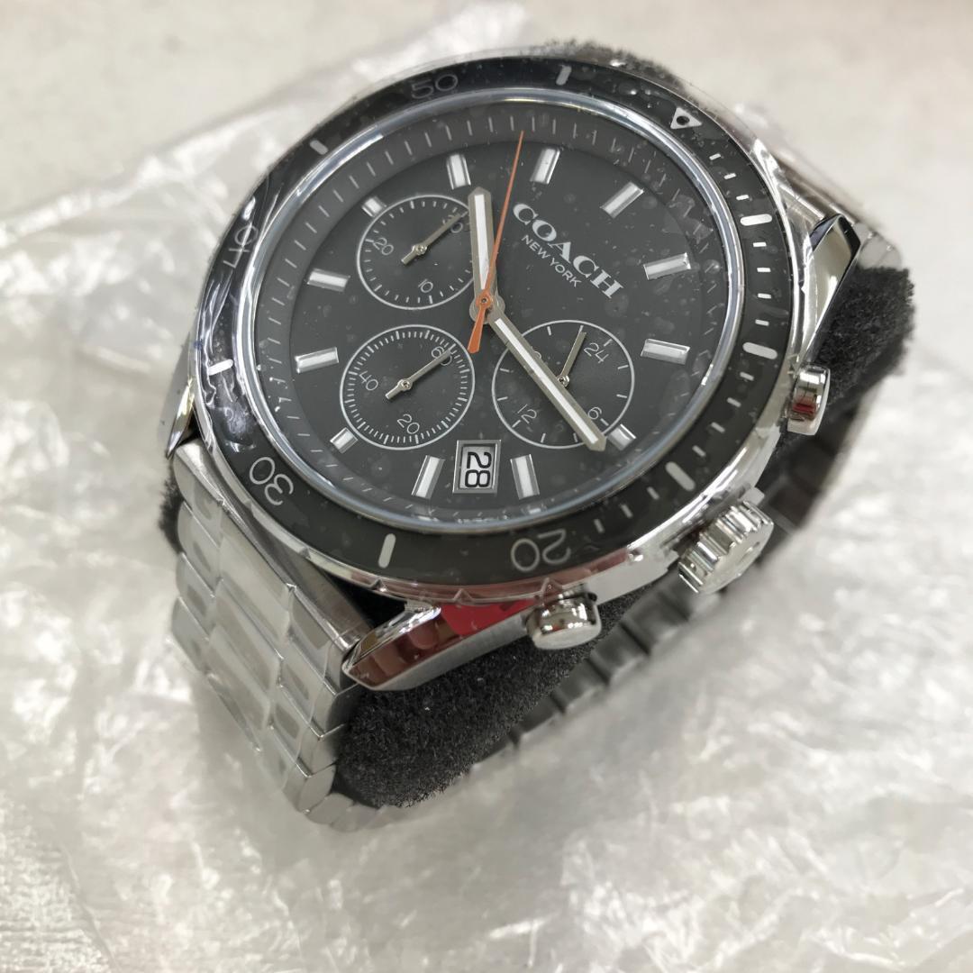 Coach Preston watch side view displaying silver metal case and dial