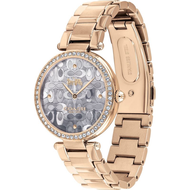 Coach rose gold women's watch shown from side angle with link bracelet