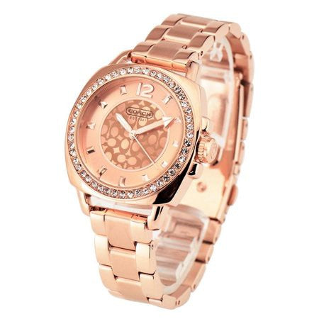 Side angle view of Coach rose gold watch with crystal-set bezel