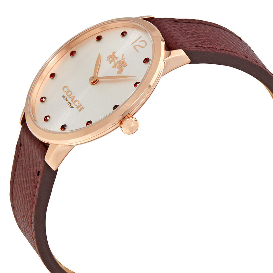 Coach Slim Easton watch at angle showing rose gold case and burgundy leather strap