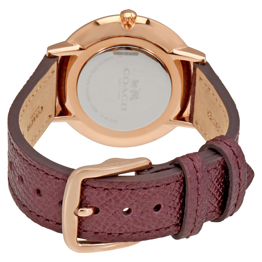 Coach Slim Easton watch caseback displaying rose gold case and burgundy leather strap with buckle