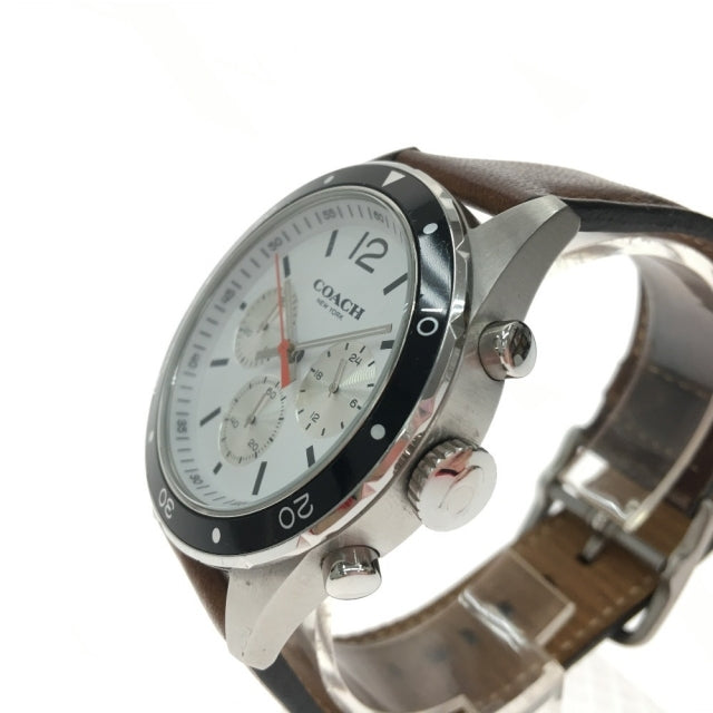 Coach Sullivan chronograph watch angled side view showing brown leather strap and silver pushers