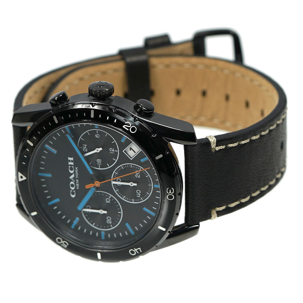 Coach Thompson chronograph watch shown at angle displaying black case and tan leather strap