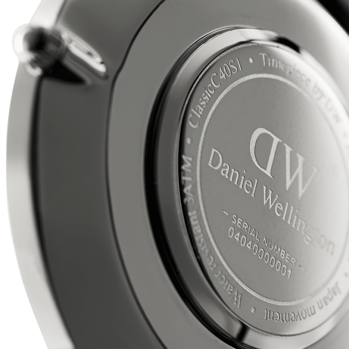 Silver caseback of Daniel Wellington Classic Oxford showing serial number DW00100046