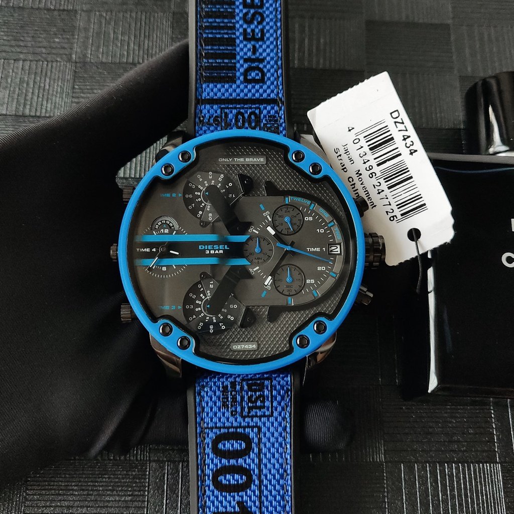 Diesel Mr. Daddy 2.0 DZ7434 worn on wrist with hang tag, showing blue strap and chronograph dial