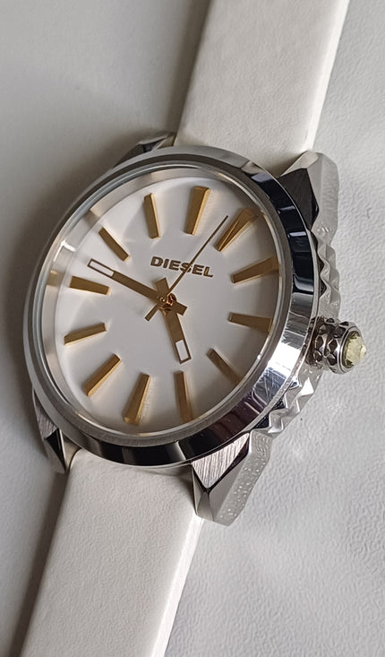 Diesel Nuki DZ5501 on white strap showing white dial with gold hour markers