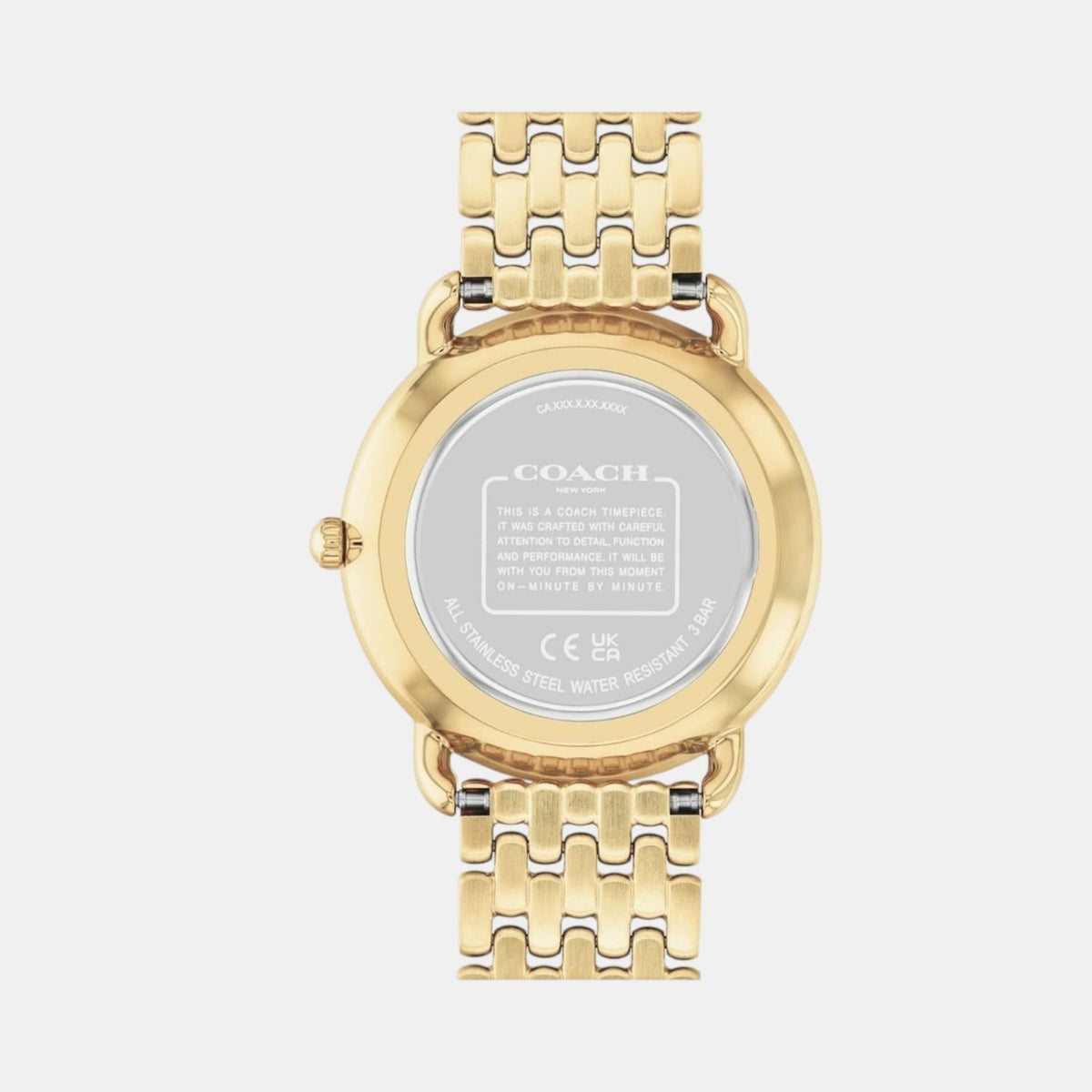 Caseback of Elliot watch showing engraved Coach branding and specifications