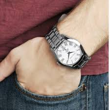 Emporio Armani AR0647 silver watch worn on wrist with white dial and Roman numerals