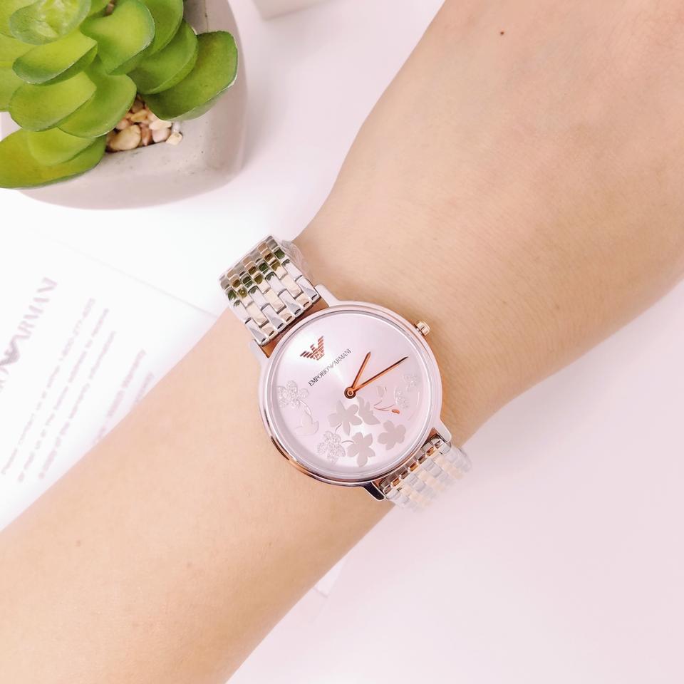 Emporio Armani AR11113 ladies watch on wrist with silver dial and two-tone mesh bracelet