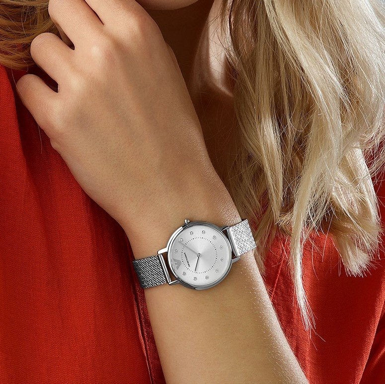 Ladies wearing Emporio Armani AR11128 on wrist with silver mesh band