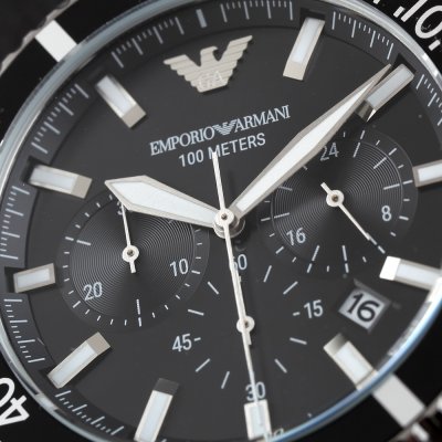 Close-up of Emporio Armani AR11360 dial showing 100 meters water resistance and chronograph subdials