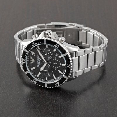 Emporio Armani AR11360 chronograph watch on wrist showing black dial and steel bracelet