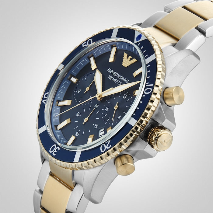 Blue dial chronograph watch at angle showing crown, pushers, and bezel detail