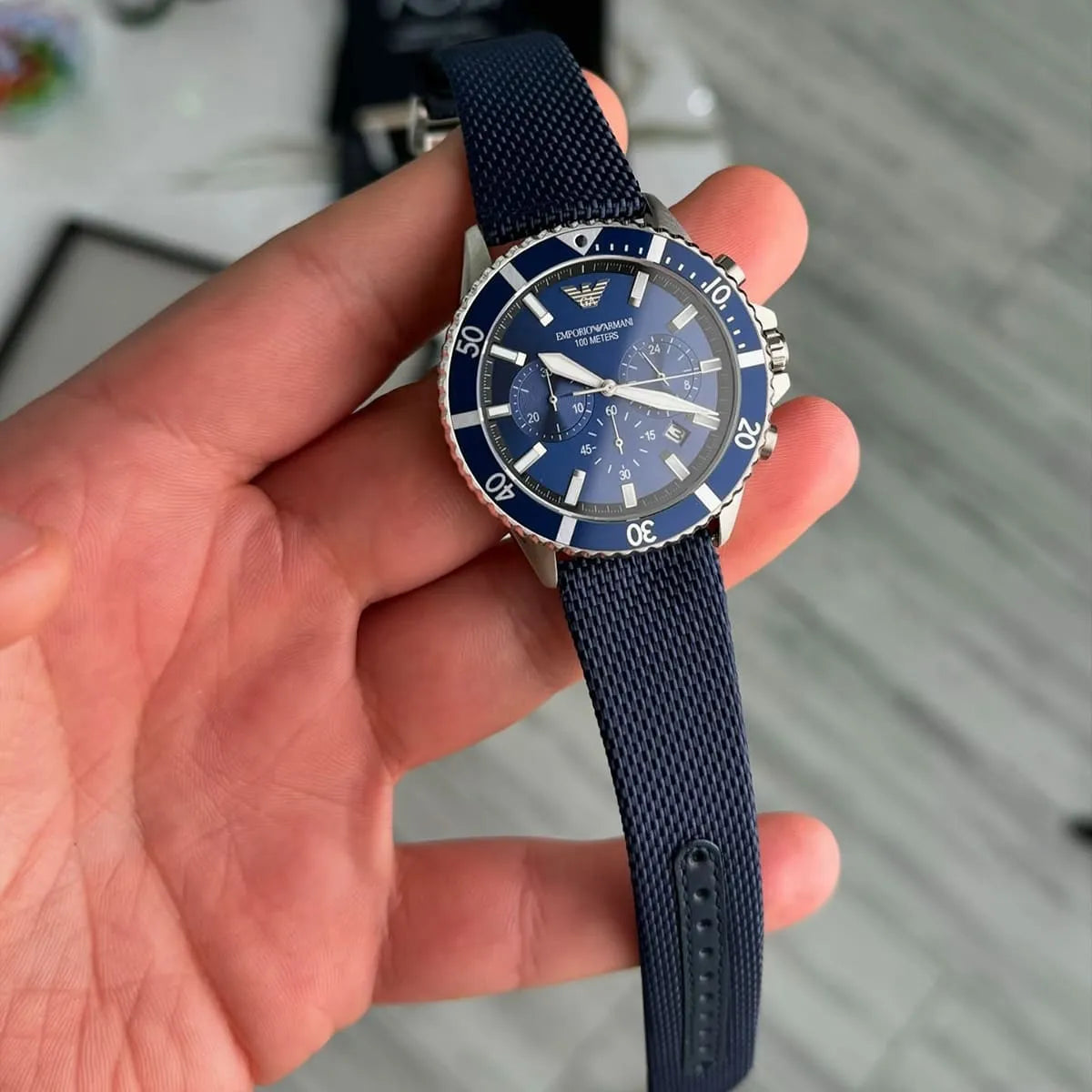 Close-up of Emporio Armani AR11588 blue dial chronograph watch on wrist