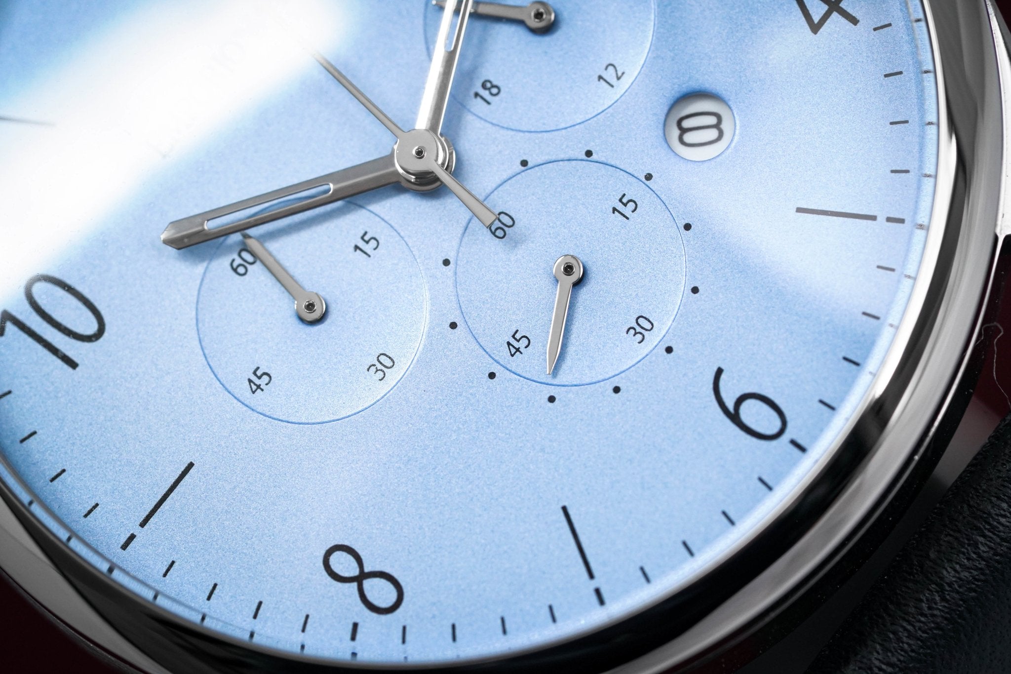 Emporio Armani AR1889 dial detail showing light blue face with chronograph subdials