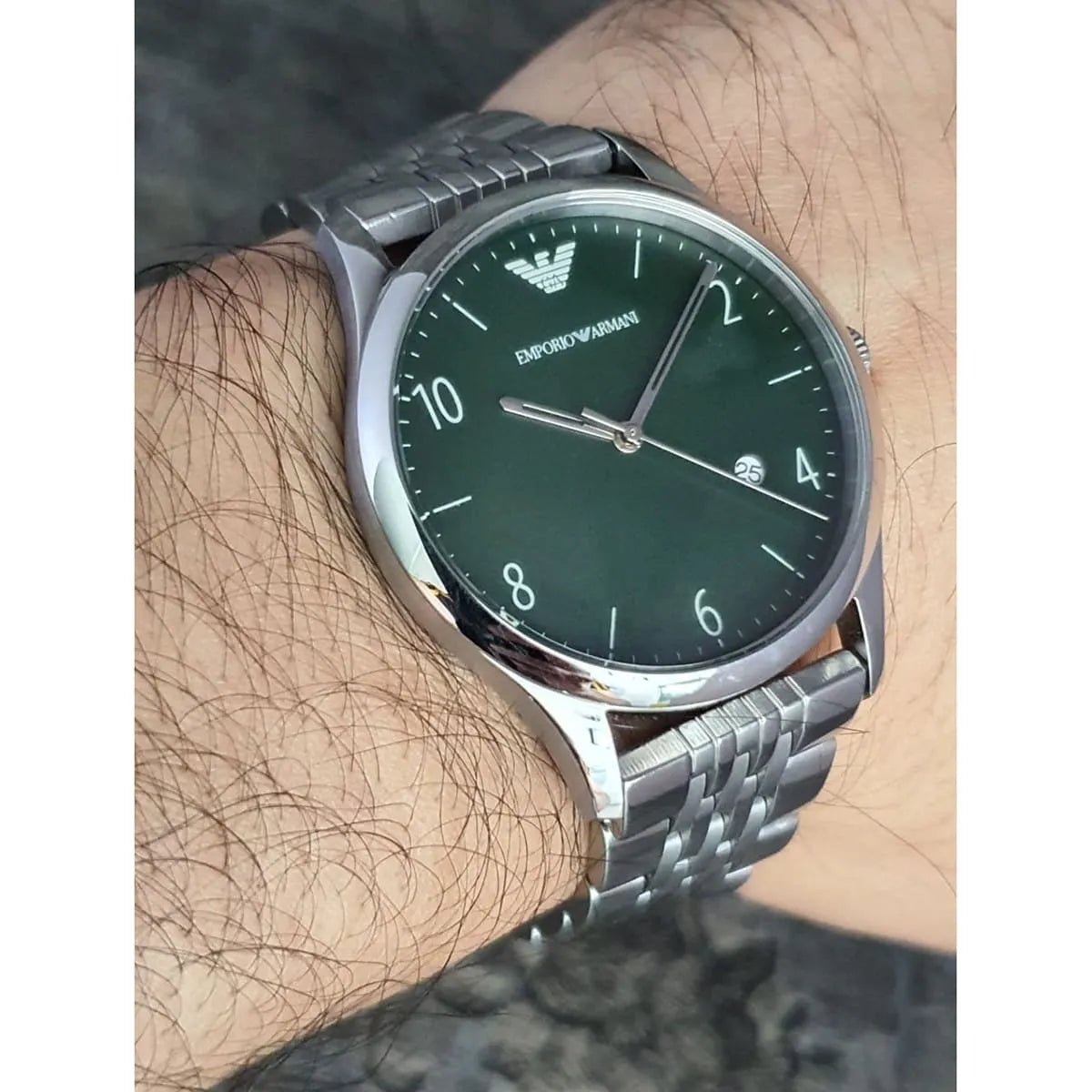 Emporio Armani AR1943 men's watch worn on wrist showing green dial and silver bracelet