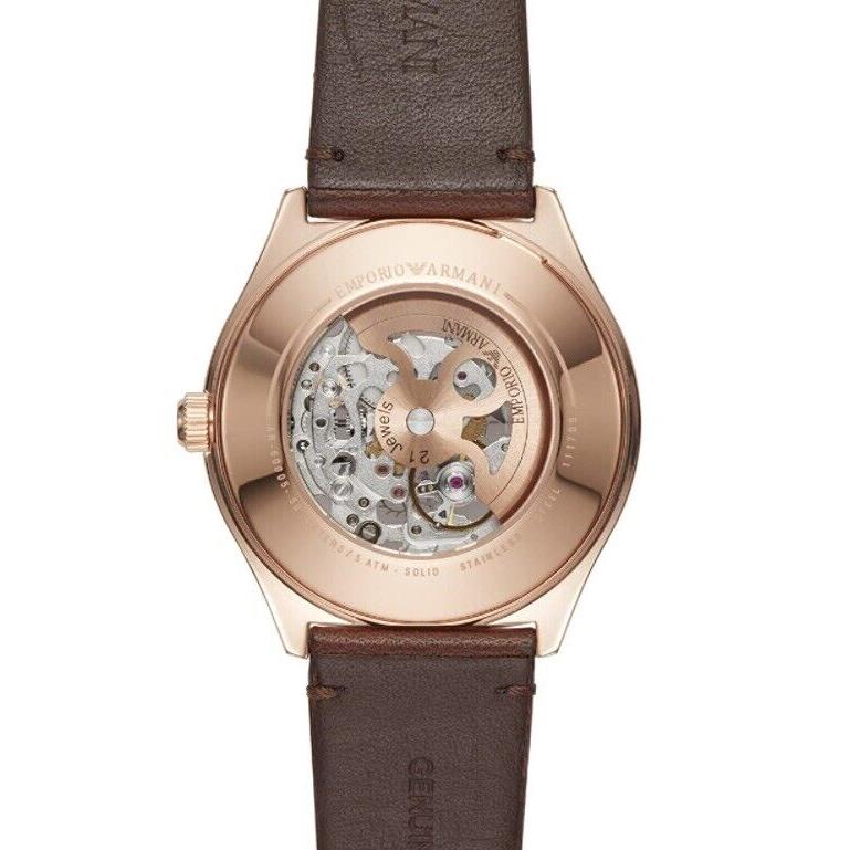 Emporio Armani AR60005 caseback showing Meccanico skeleton movement through display