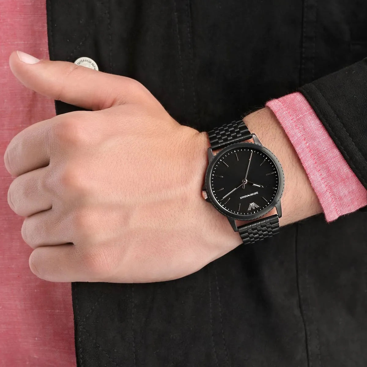 Emporio Armani AR80021 black watch on wrist with rose gold accents and metal strap