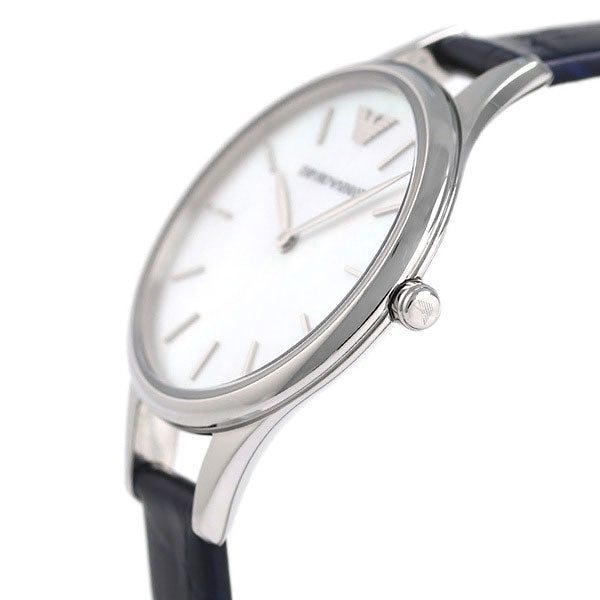 Close-up of AR11090 dial with Emporio Armani logo, white pearl face, and applied indices