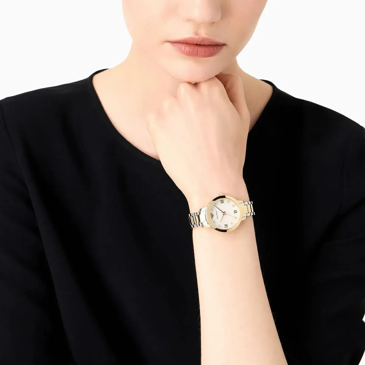 Emporio Armani Cleo watch worn on wrist with two-tone metal strap and MOP dial