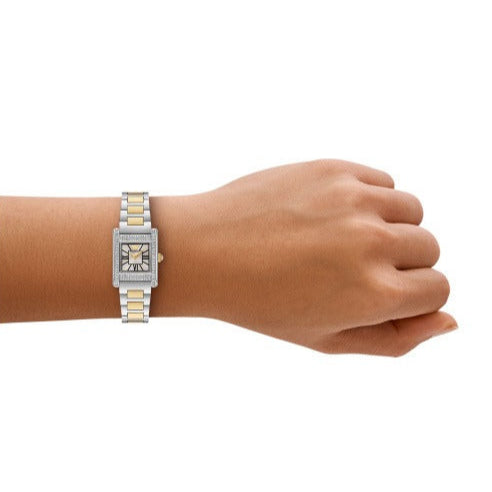Emporio Armani Genni watch worn on wrist showing rectangular dial and two-tone stainless steel bracelet