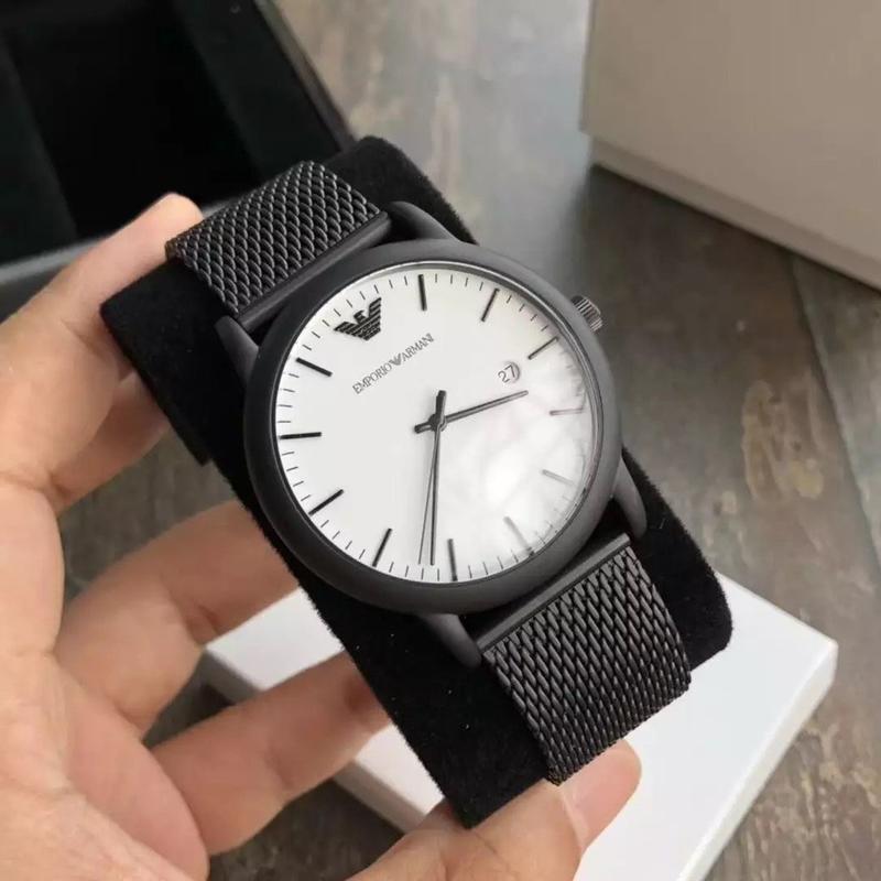 Emporio Armani Luigi white dial watch worn on wrist with black mesh strap