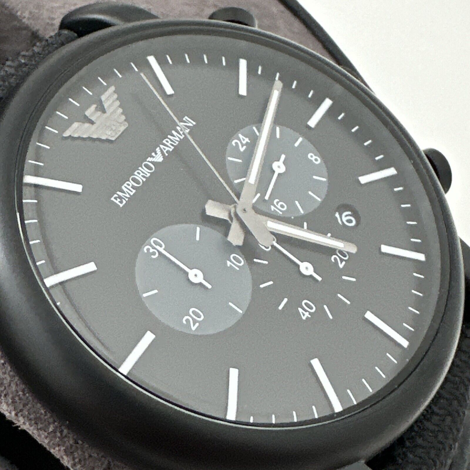 Close-up detail of Emporio Armani Luigi AR11450 black chronograph dial with subdials