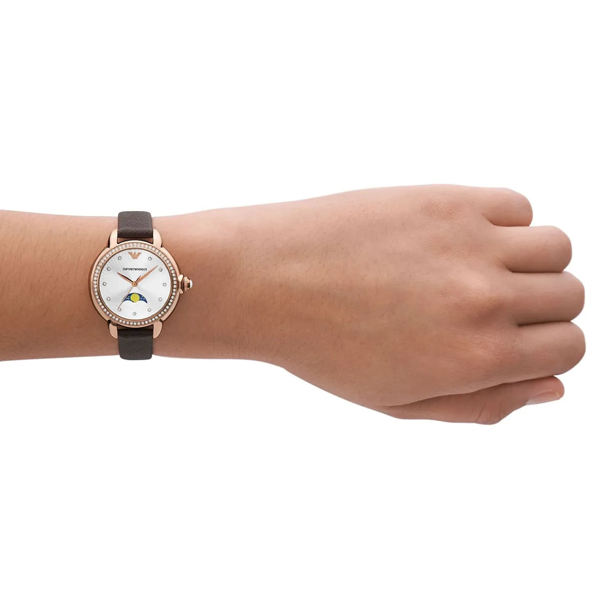 Emporio Armani Mia watch worn on wrist showing silver dial, moonphase, and brown leather strap