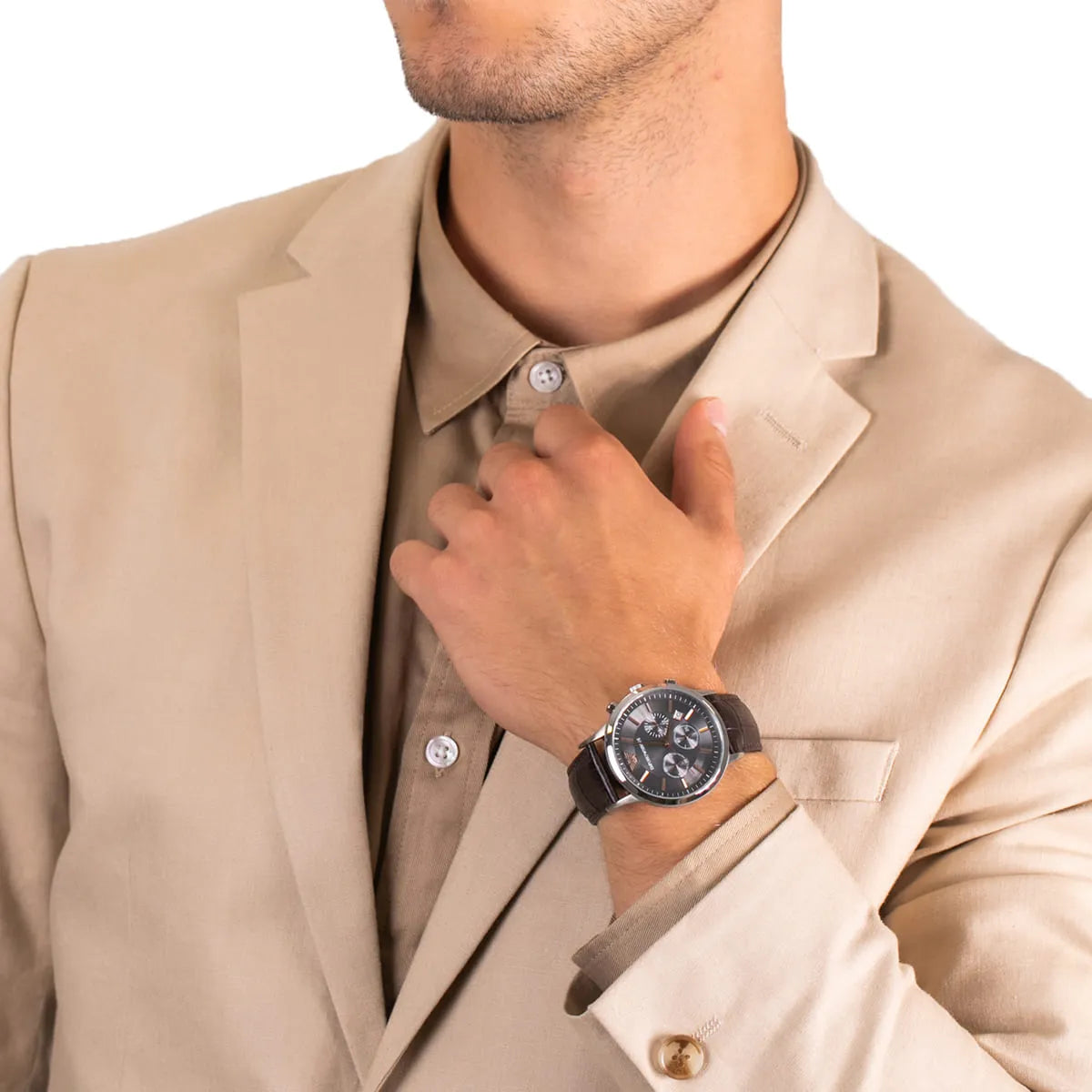 Emporio Armani Renato chronograph watch worn on wrist with grey dial and brown leather strap