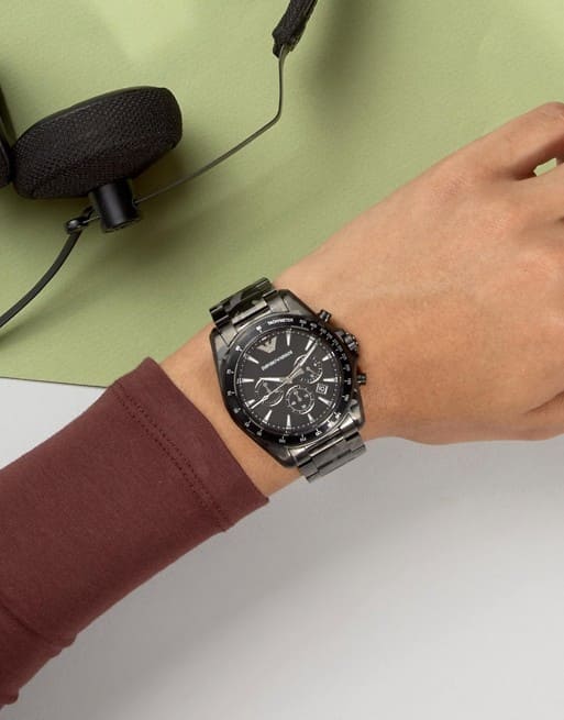 AR11027 chronograph watch on wrist with black dial and three subdials visible