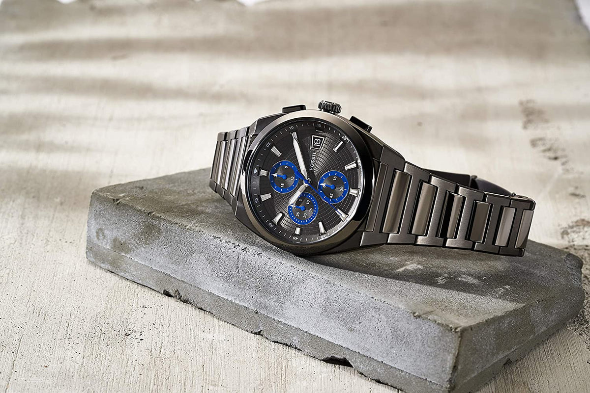 Fossil Everett chronograph watch worn on wrist, grey dial with blue subdials visible