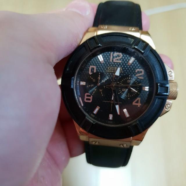 Guess Rigor watch worn on wrist showing black dial and rose gold bezel